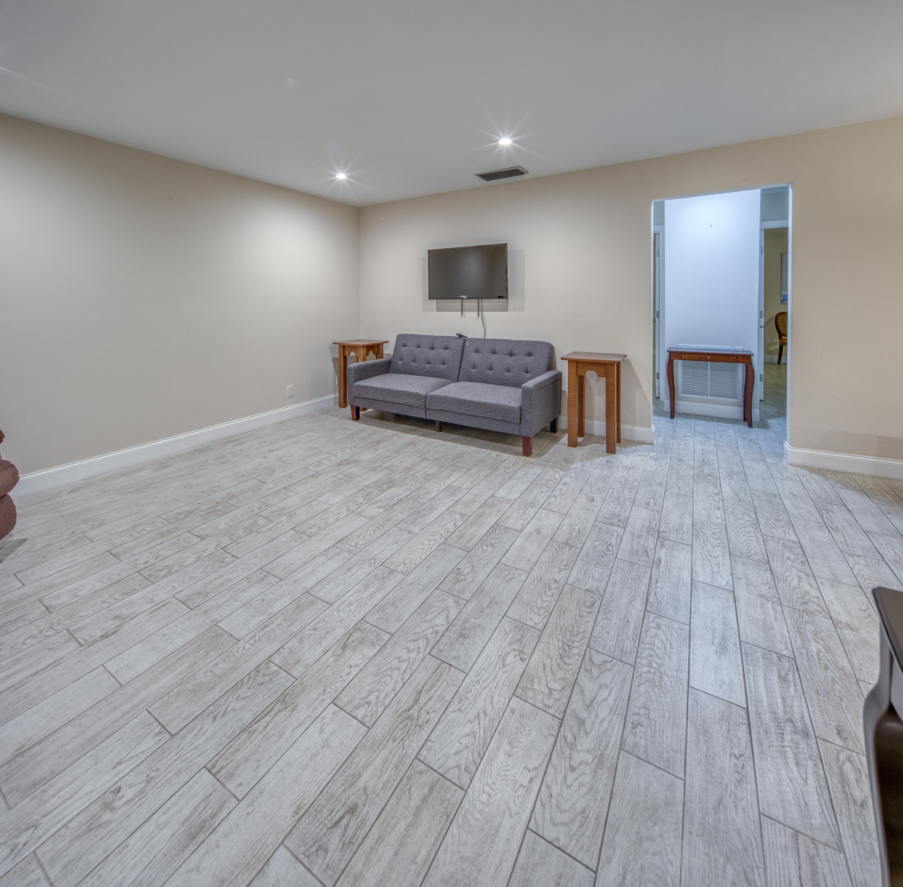 301 South Lakeside Drive, Unit 7 Lake Worth Beach, FL 33460 - Photo 2 of 15 a living room with furniture and natural light