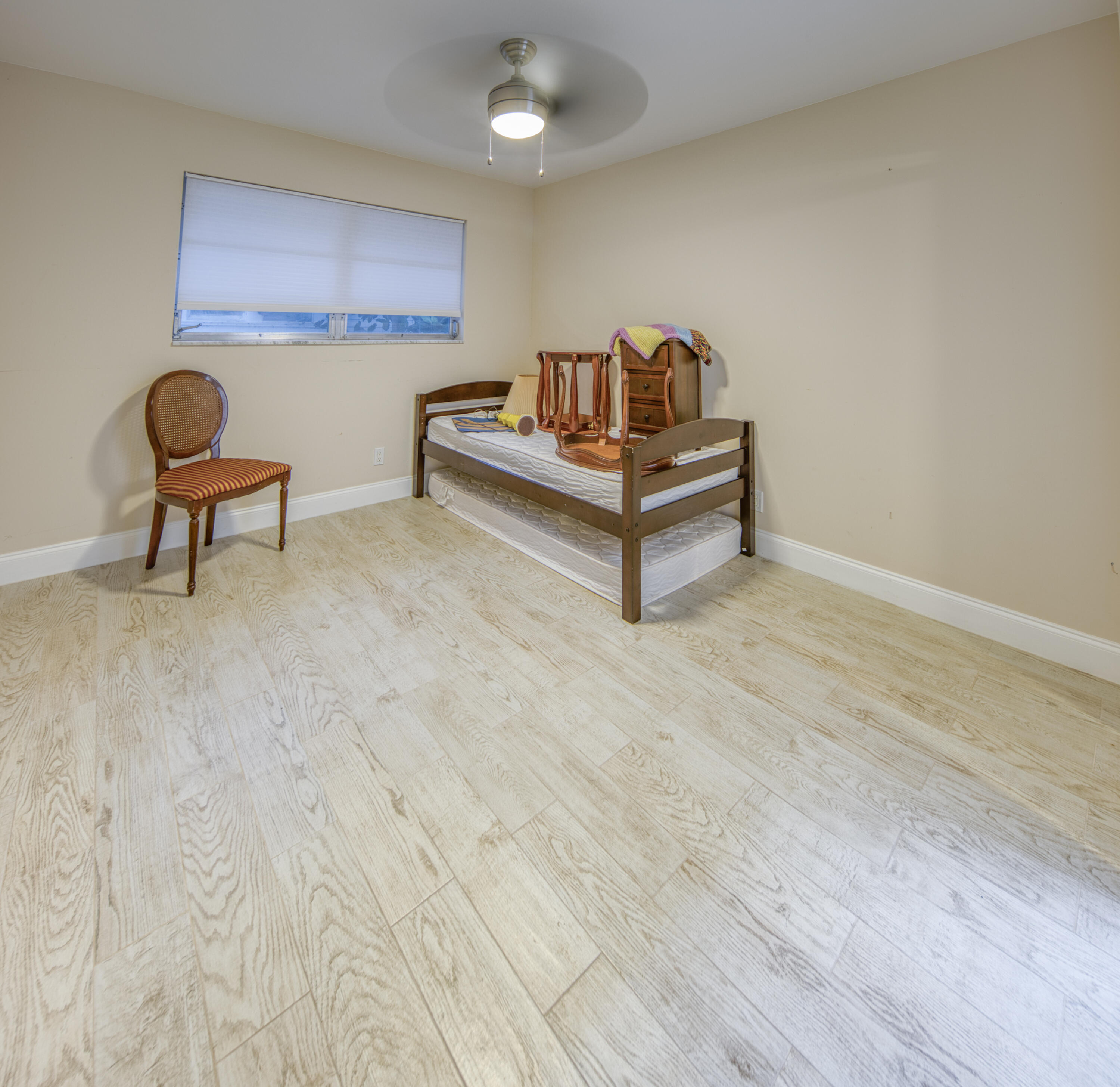301 South Lakeside Drive, Unit 7 Lake Worth Beach, FL 33460 - Photo 6 of 15 a living room with furniture and a wooden floor