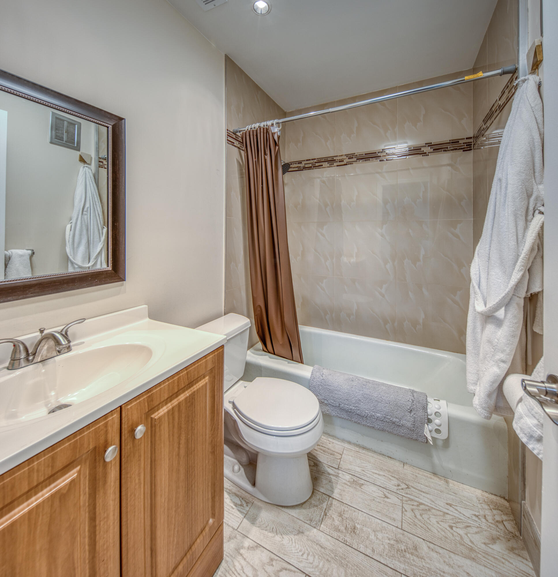 301 South Lakeside Drive, Unit 7 Lake Worth Beach, FL 33460 - Photo 10 of 15 a bathroom with a granite countertop sink toilet and shower