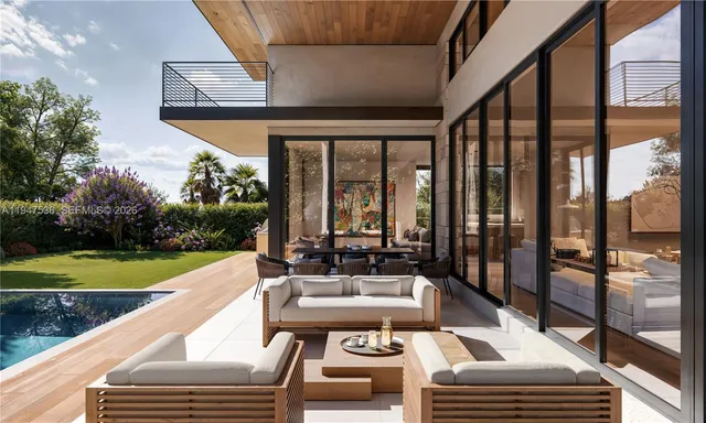 a view of a patio with chairs and a table