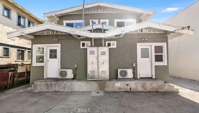 a front view of a house with a large windows