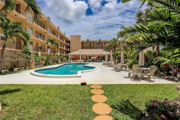 a view of a swimming pool with a patio