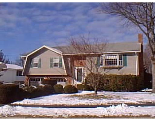 16 Milepost Road Reading, MA 01867 - Photo 1 of 1 a house that has a tree in front of it