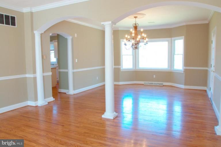 13925 Sunnybrook Road Phoenix, MD 21131 - Photo 11 of 30 a view of empty room with wooden floor and fan