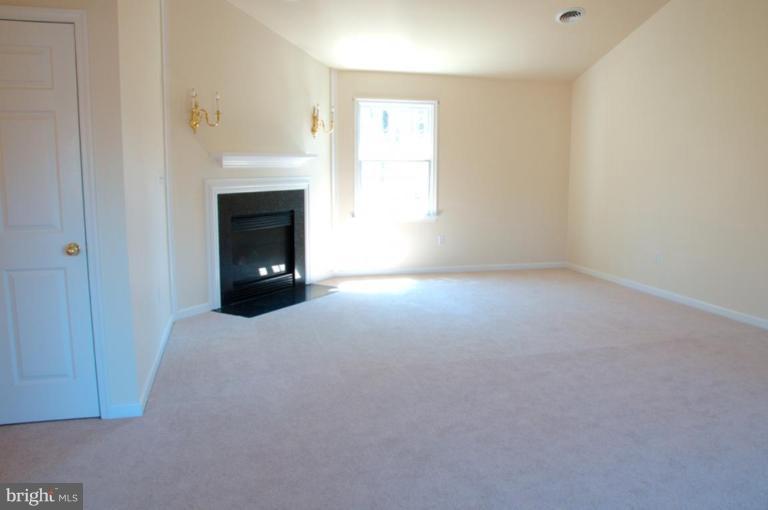 13925 Sunnybrook Road Phoenix, MD 21131 - Photo 12 of 30 a view of empty room with a fireplace