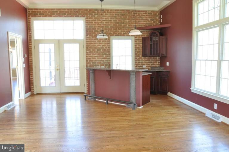 13925 Sunnybrook Road Phoenix, MD 21131 - Photo 13 of 30 an empty room with wooden floor and windows