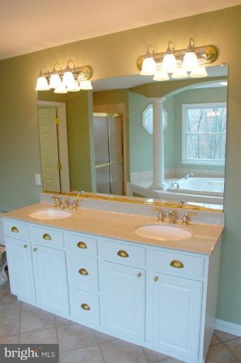 13925 Sunnybrook Road Phoenix, MD 21131 - Photo 17 of 30 a bathroom with a sink and a mirror