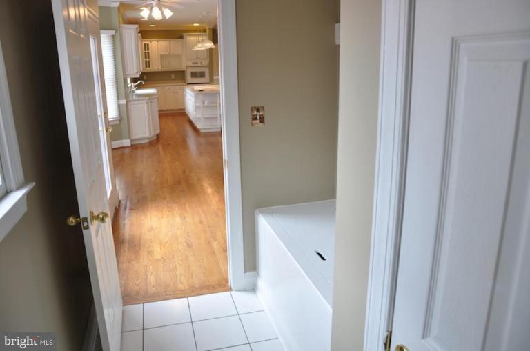 13925 Sunnybrook Road Phoenix, MD 21131 - Photo 23 of 30 a bathroom with a granite countertop shower and a sink