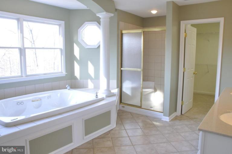 13925 Sunnybrook Road Phoenix, MD 21131 - Photo 7 of 30 a bathroom with a sink a toilet and shower