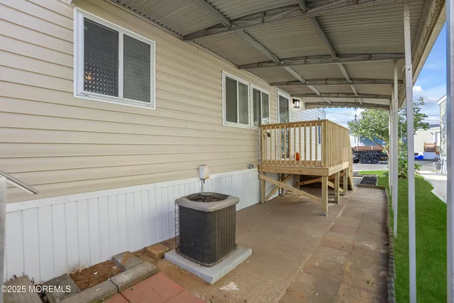 a view of a patio with table and chairs
