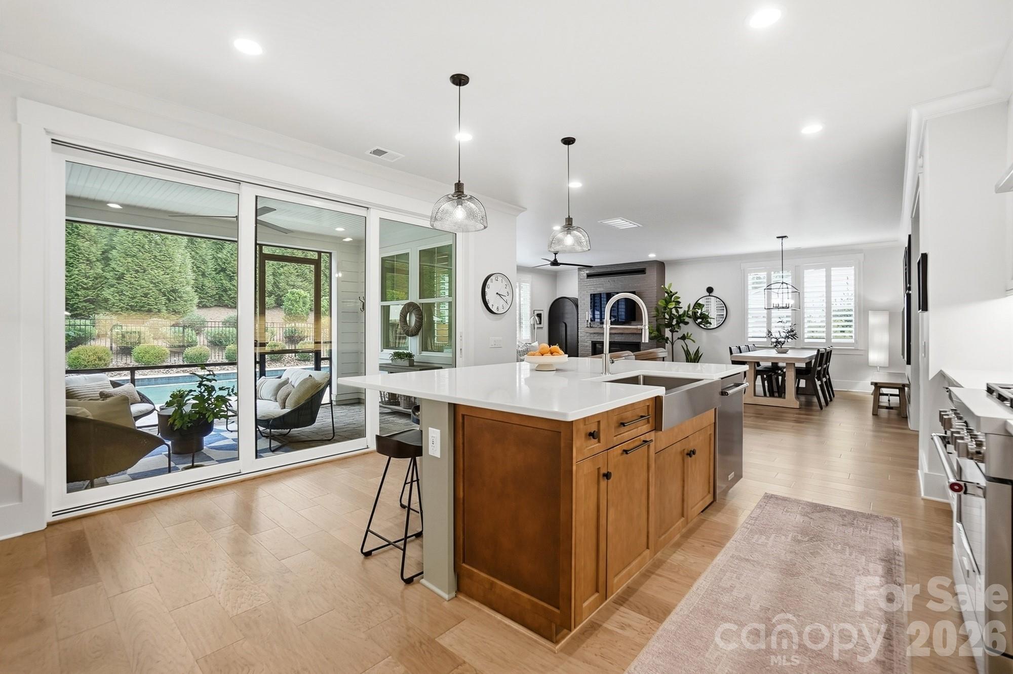 2052 Thatcher Way Fort Mill, SC 29715 - Photo 13 of 47 a kitchen with a stove and a view of living room