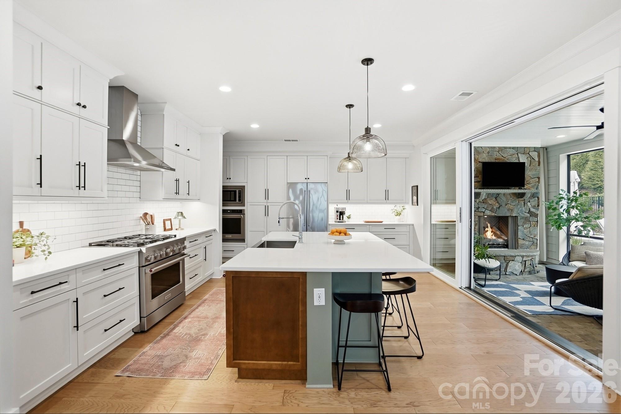 2052 Thatcher Way Fort Mill, SC 29715 - Photo 14 of 47 a large kitchen with a table and chairs in it