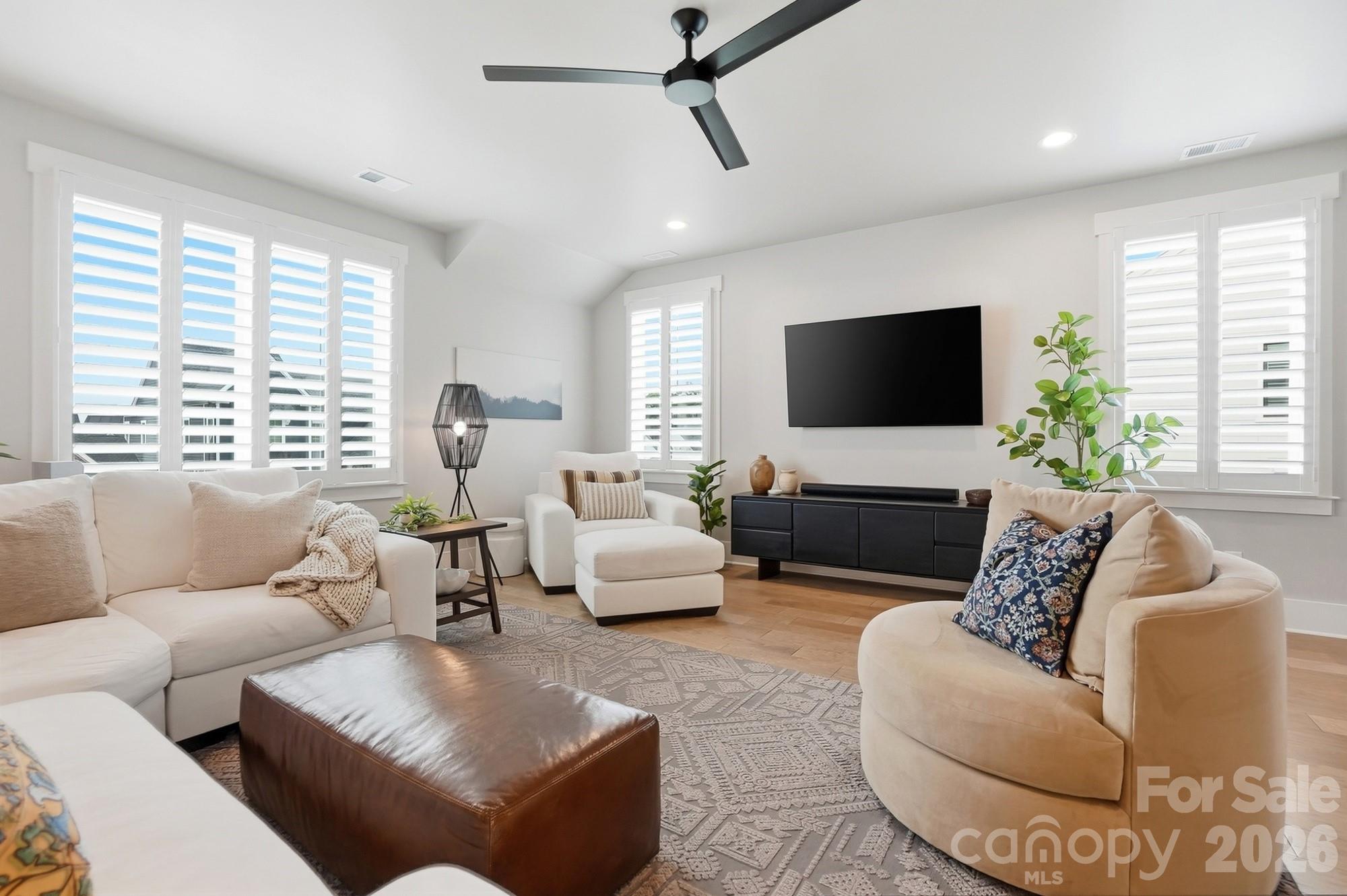 2052 Thatcher Way Fort Mill, SC 29715 - Photo 28 of 47 a living room with furniture and a flat screen tv