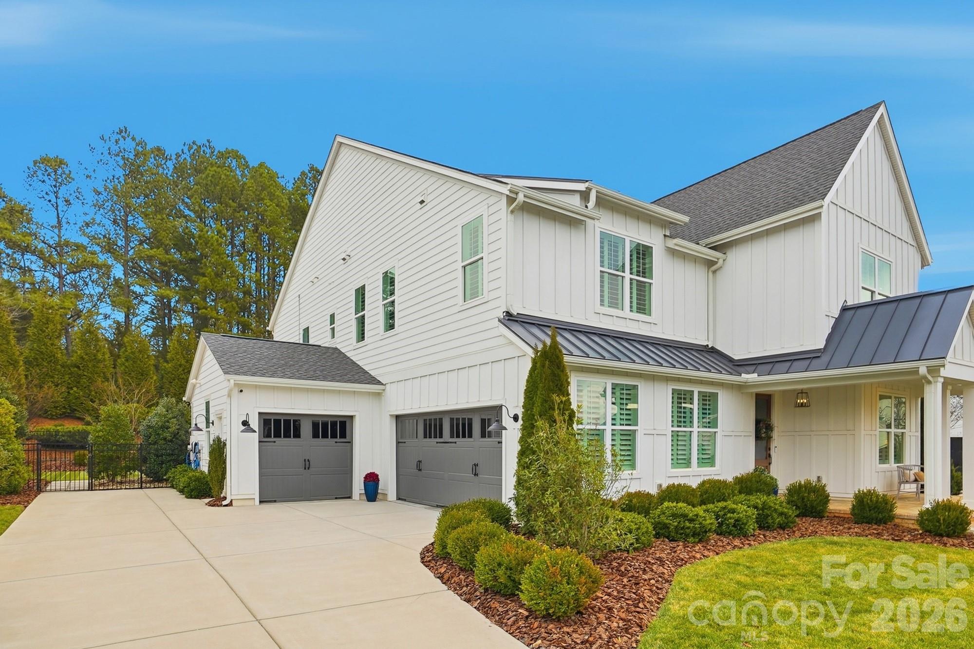 2052 Thatcher Way Fort Mill, SC 29715 - Photo 4 of 47 a front view of a house with a garden