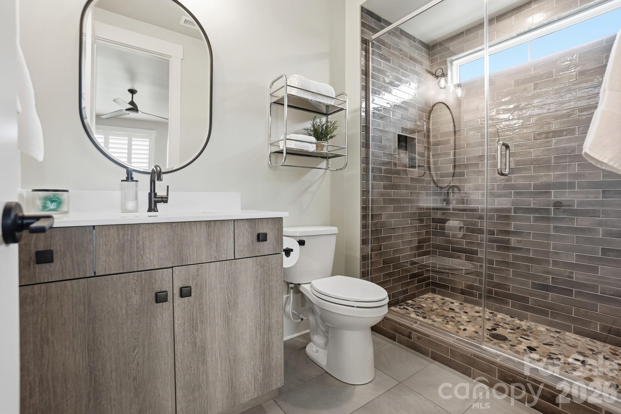 2052 Thatcher Way Fort Mill, SC 29715 - Photo 41 of 47 a bathroom with a toilet a sink and mirror