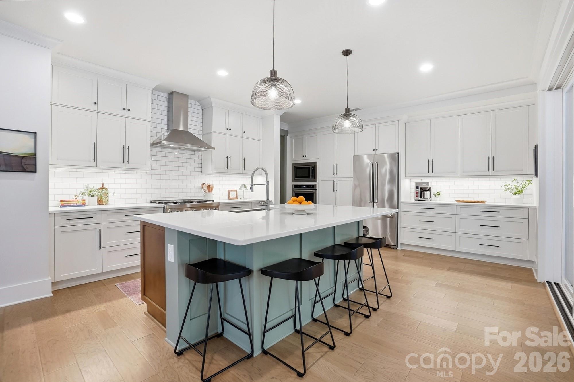 2052 Thatcher Way Fort Mill, SC 29715 - Photo 6 of 47 a kitchen with kitchen island granite countertop a sink a center island and cabinets