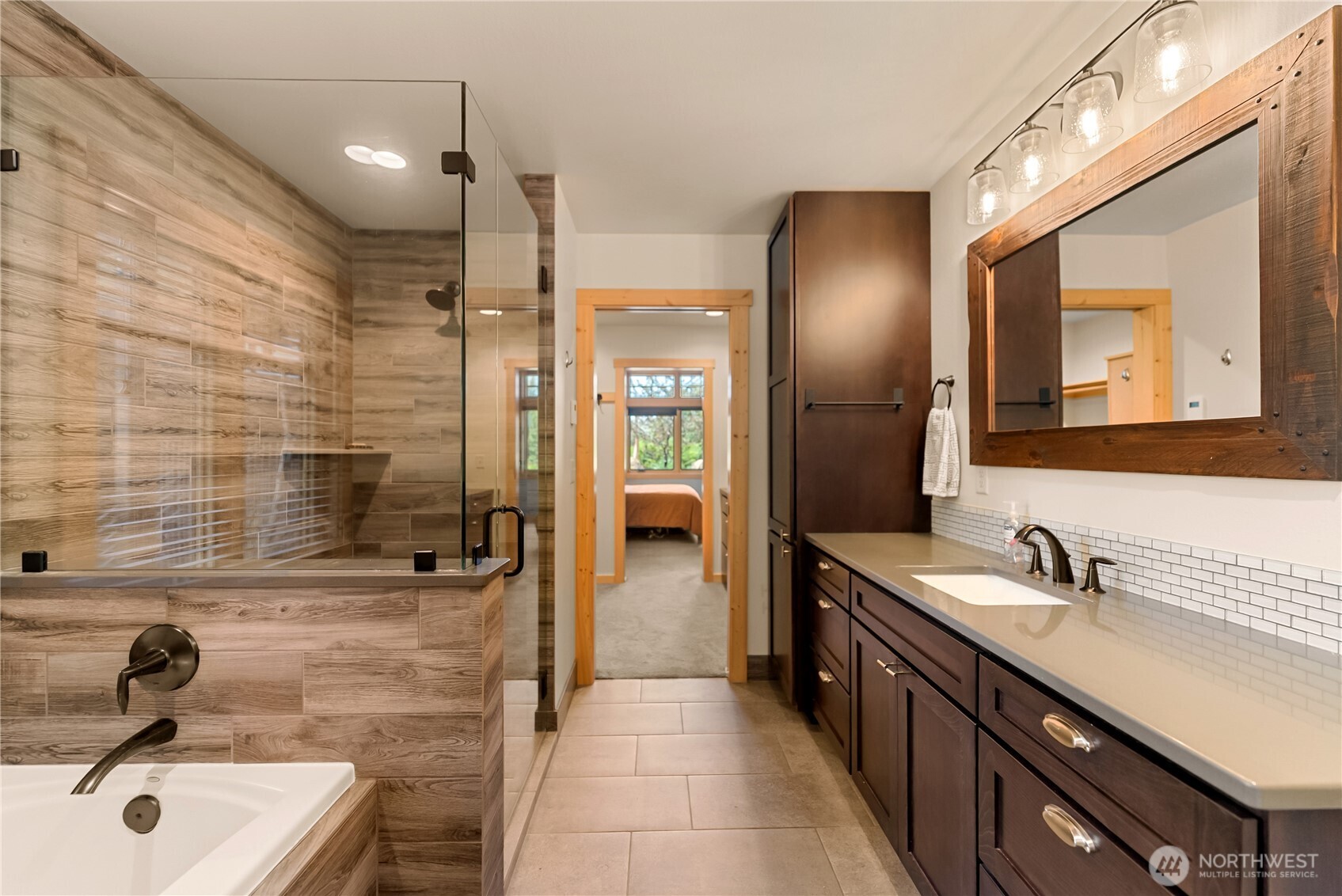 130 Sundown Road Winthrop, WA 98862 - Photo 20 of 40 a bathroom with a double vanity sink a and mirror