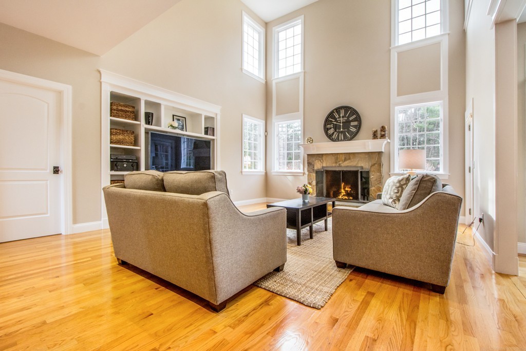 49 Amanda Road Sudbury, MA 01776 - Photo 11 of 30 a living room with furniture and a fireplace