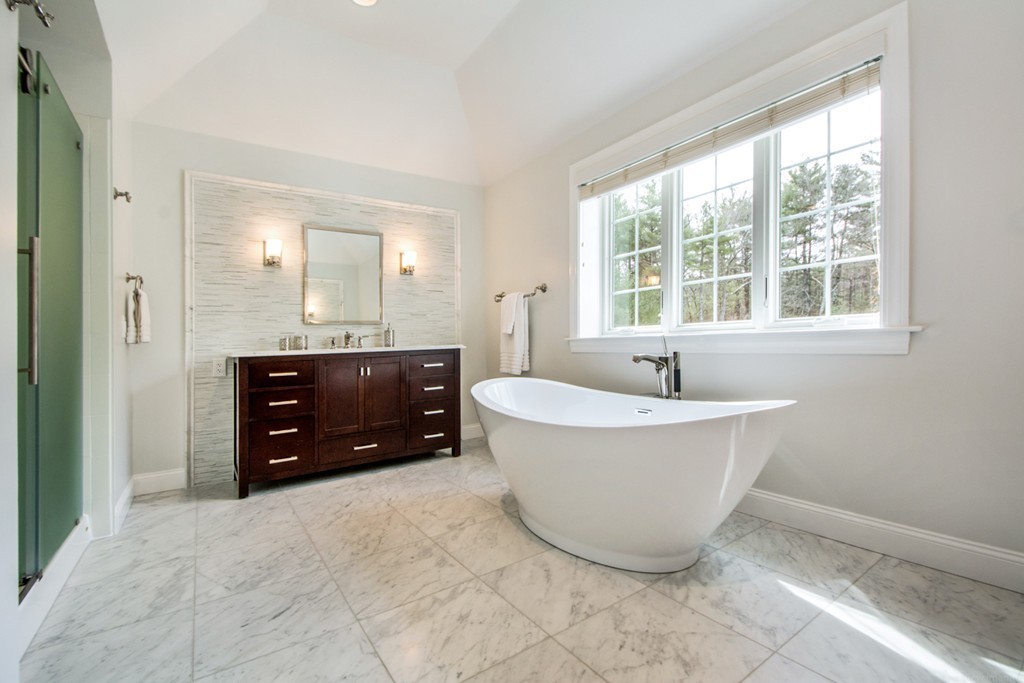 49 Amanda Road Sudbury, MA 01776 - Photo 16 of 30 a spacious bathroom with a tub sink and mirror