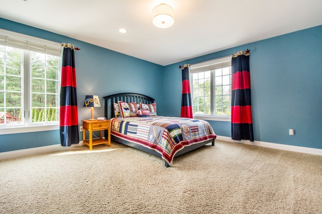 49 Amanda Road Sudbury, MA 01776 - Photo 20 of 30 a bedroom with a bed and windows