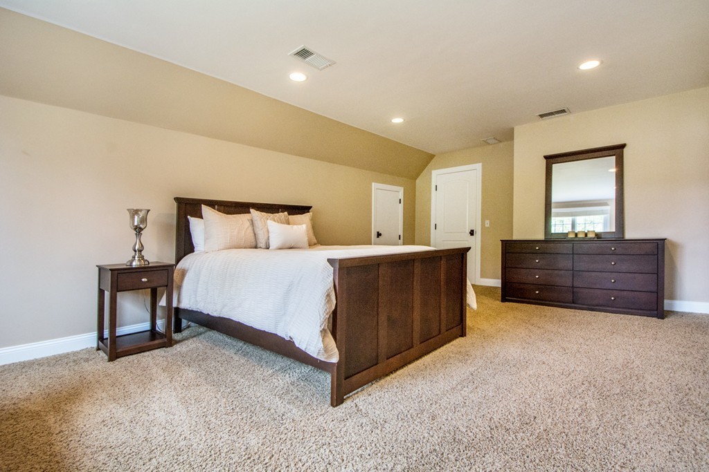 49 Amanda Road Sudbury, MA 01776 - Photo 21 of 30 a spacious bedroom with a bed and cabinets
