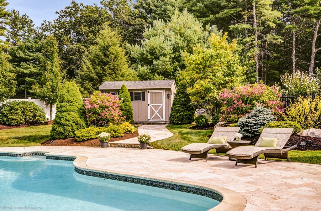 49 Amanda Road Sudbury, MA 01776 - Photo 29 of 30 a bench is sitting in the middle of a yard