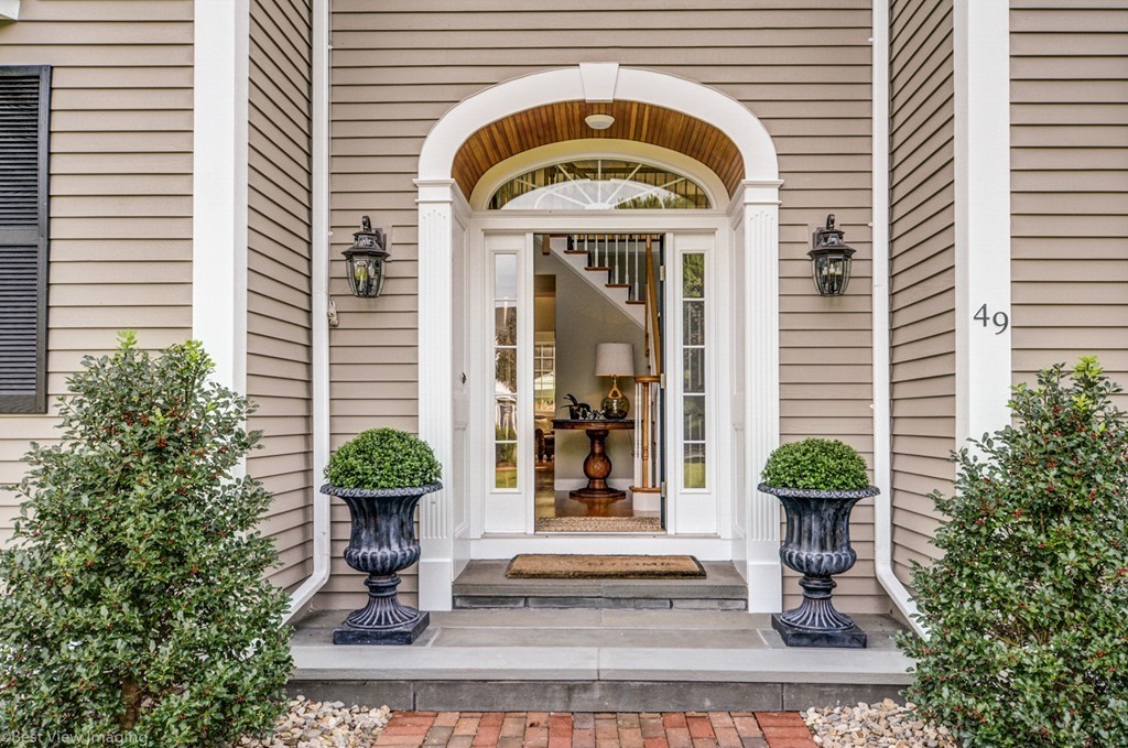 49 Amanda Road Sudbury, MA 01776 - Photo 3 of 30 a front view of a house with potted plants