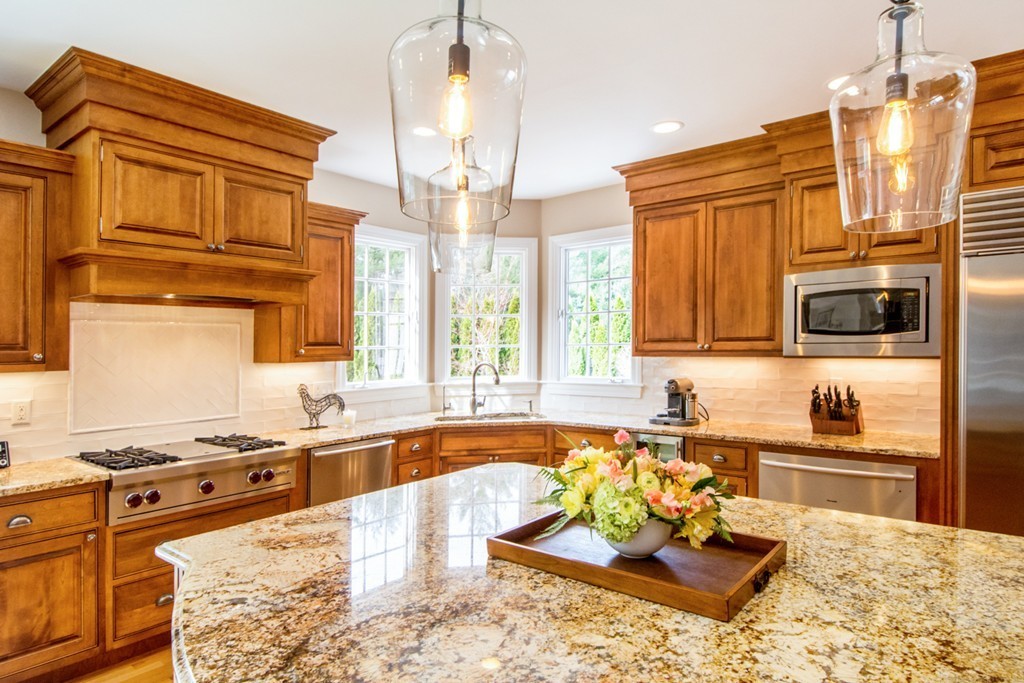 49 Amanda Road Sudbury, MA 01776 - Photo 8 of 30 a kitchen with stainless steel appliances granite countertop a sink and cabinets