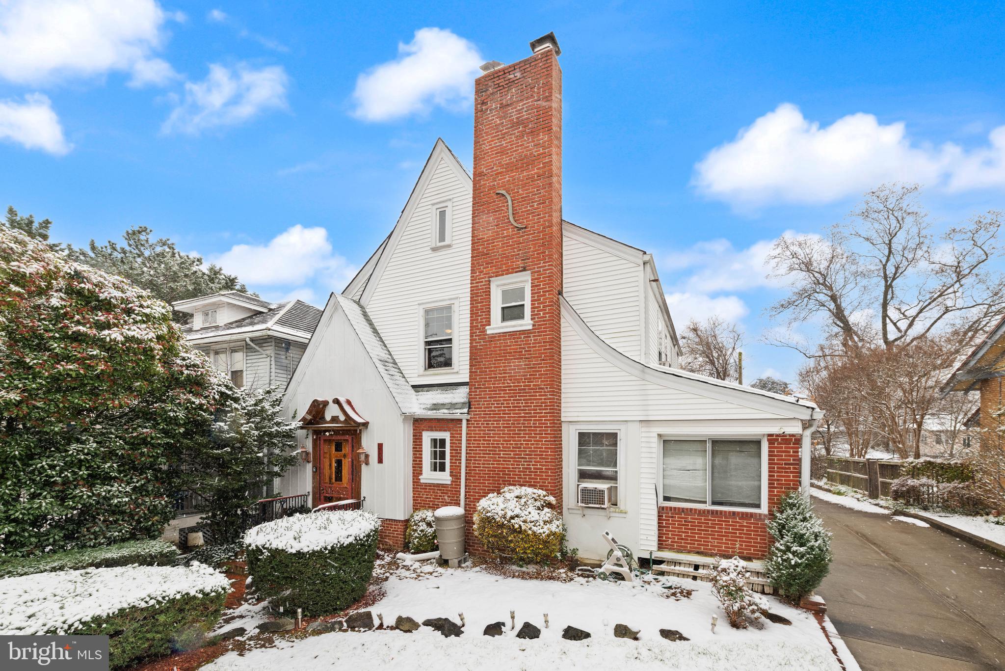 1702 Webster Street Northwest Washington, DC 20011 - Photo 1 of 42 a front view of a house with a yard