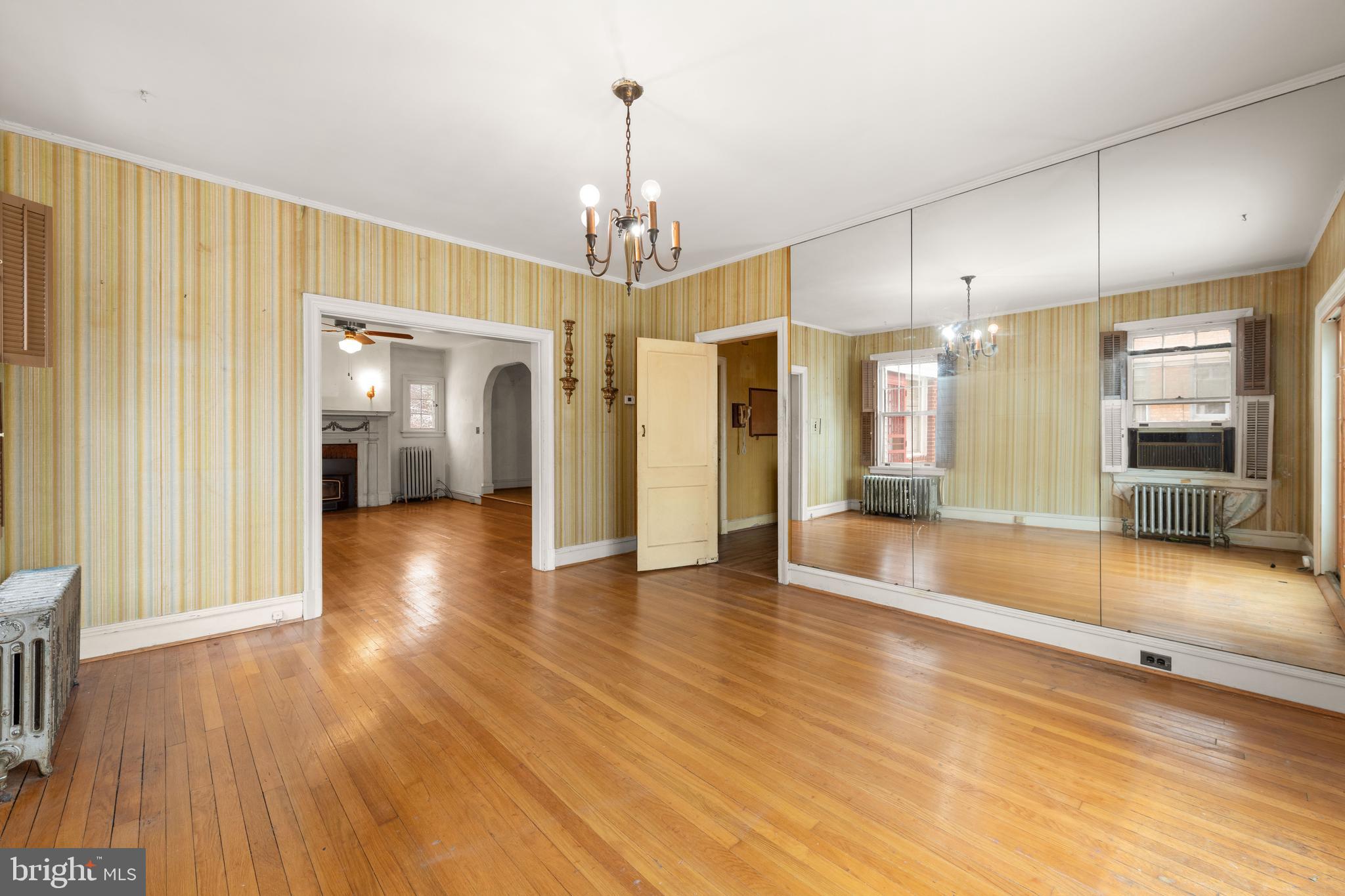 1702 Webster Street Northwest Washington, DC 20011 - Photo 12 of 42 a view of a big room with wooden floor and windows