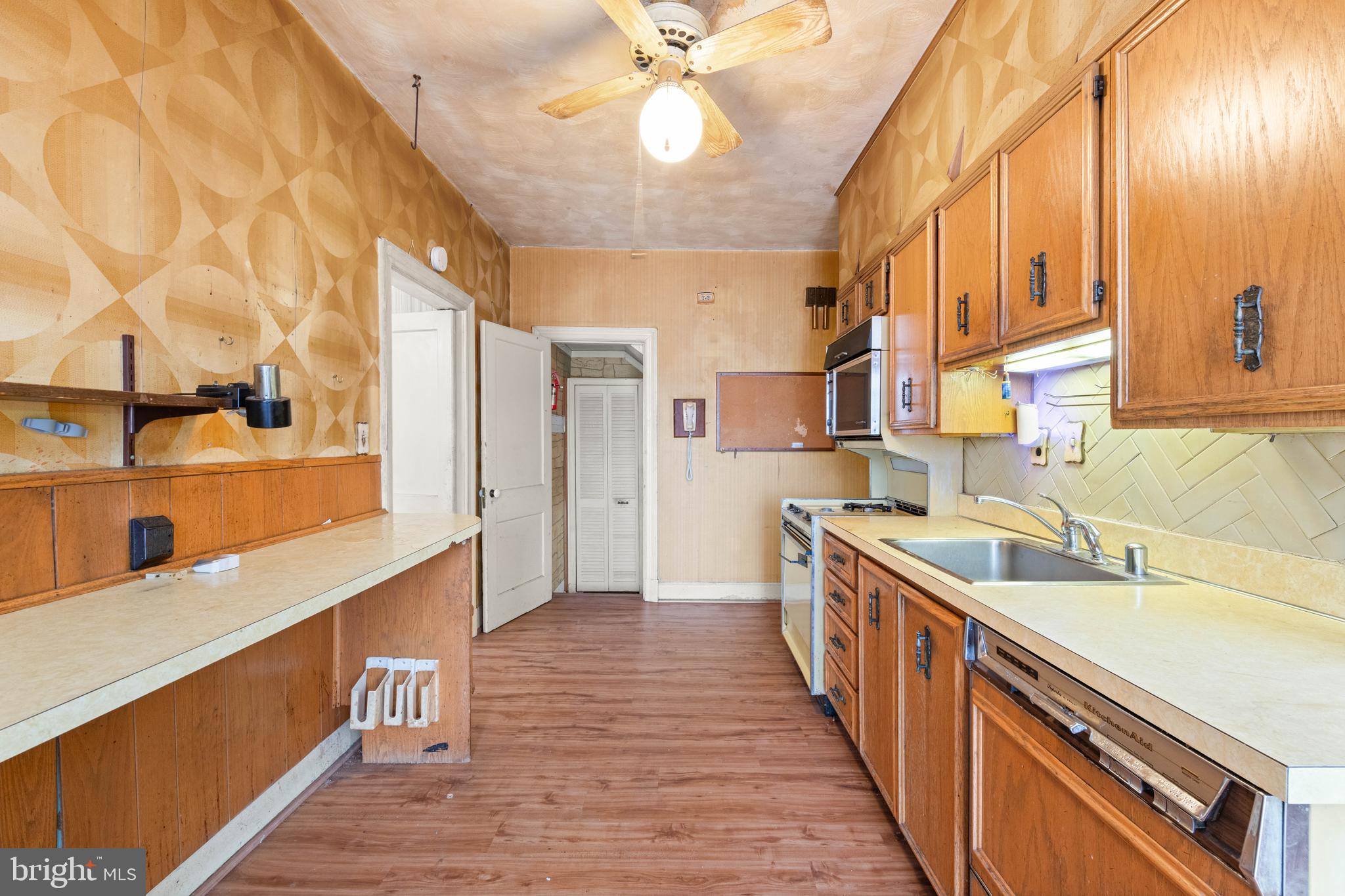 1702 Webster Street Northwest Washington, DC 20011 - Photo 14 of 42 a kitchen with sink a refrigerator and a stove