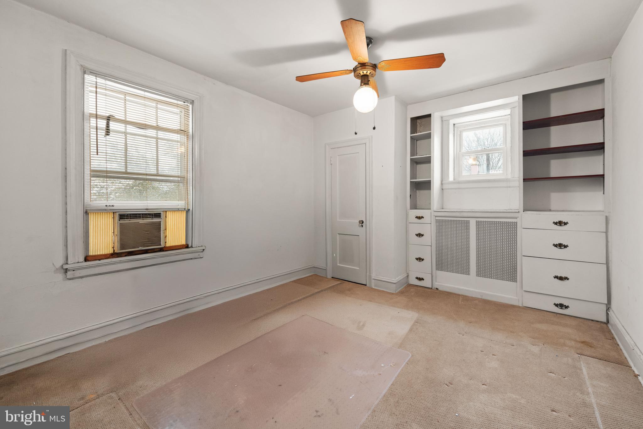 1702 Webster Street Northwest Washington, DC 20011 - Photo 20 of 42 an empty room with windows and cabinet