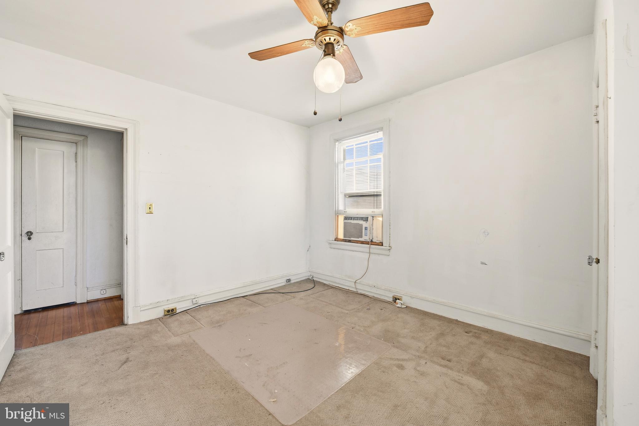 1702 Webster Street Northwest Washington, DC 20011 - Photo 21 of 42 an empty room with windows and fan