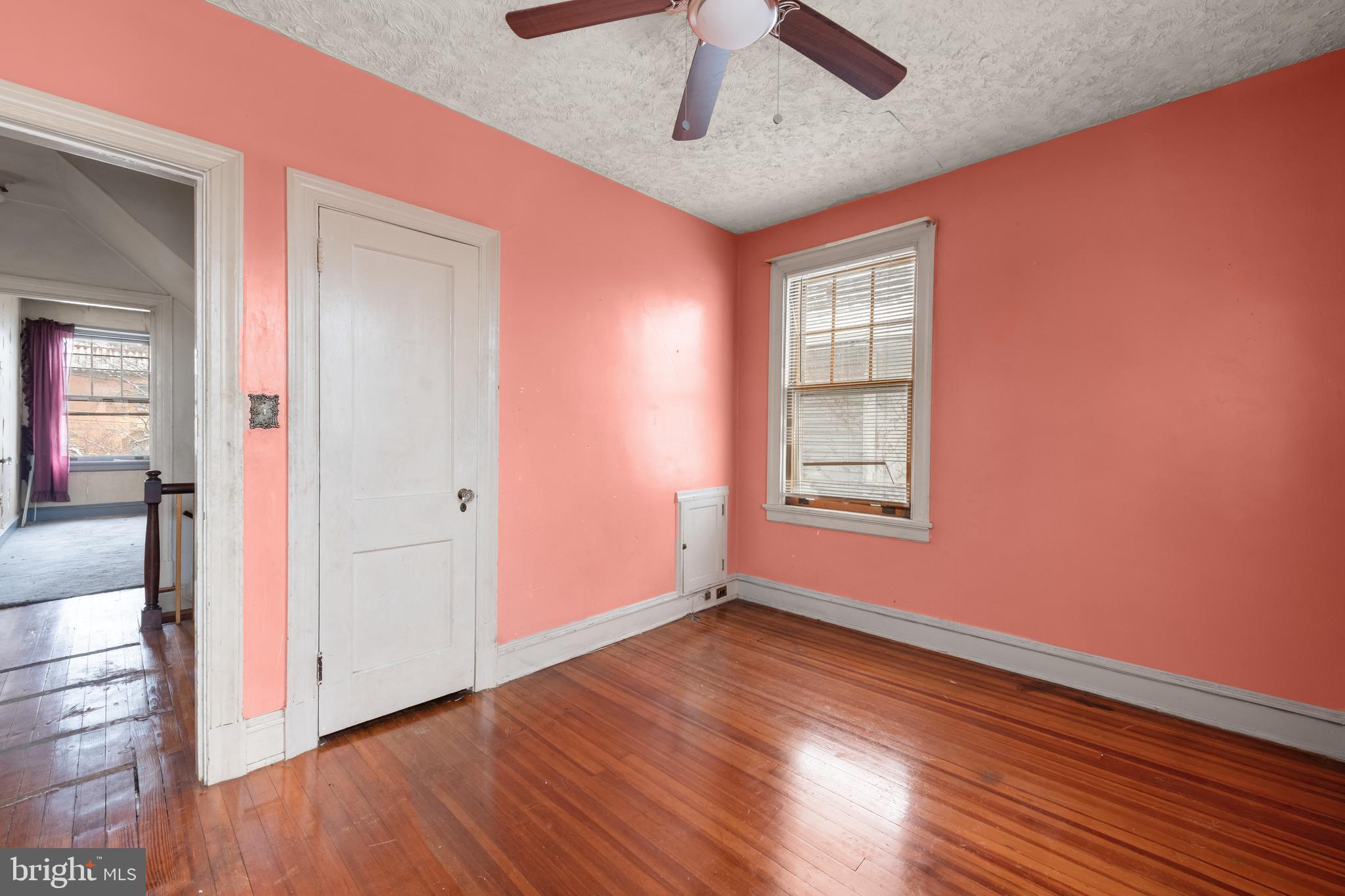1702 Webster Street Northwest Washington, DC 20011 - Photo 25 of 42 wooden floor in an empty room with a window