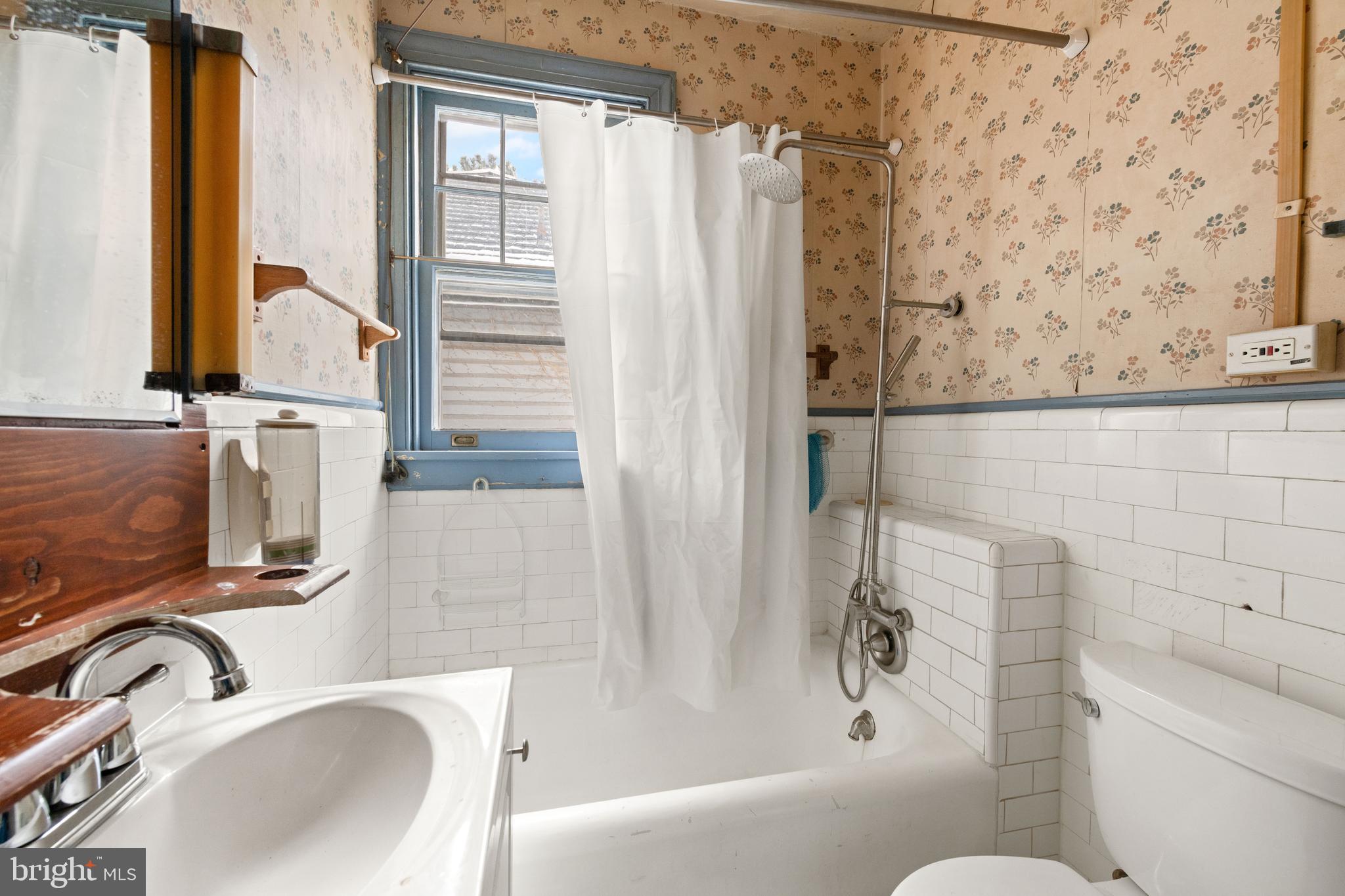 1702 Webster Street Northwest Washington, DC 20011 - Photo 30 of 42 a bathroom with a sink and a tub