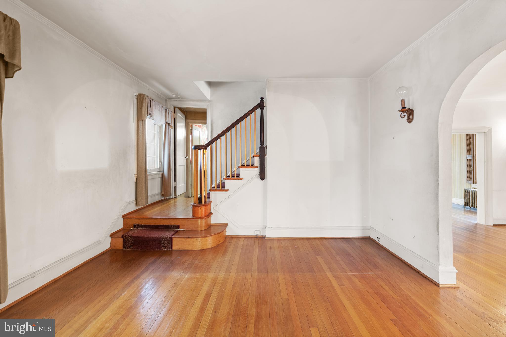 1702 Webster Street Northwest Washington, DC 20011 - Photo 3 of 42 a view of room with stairs and wooden floor