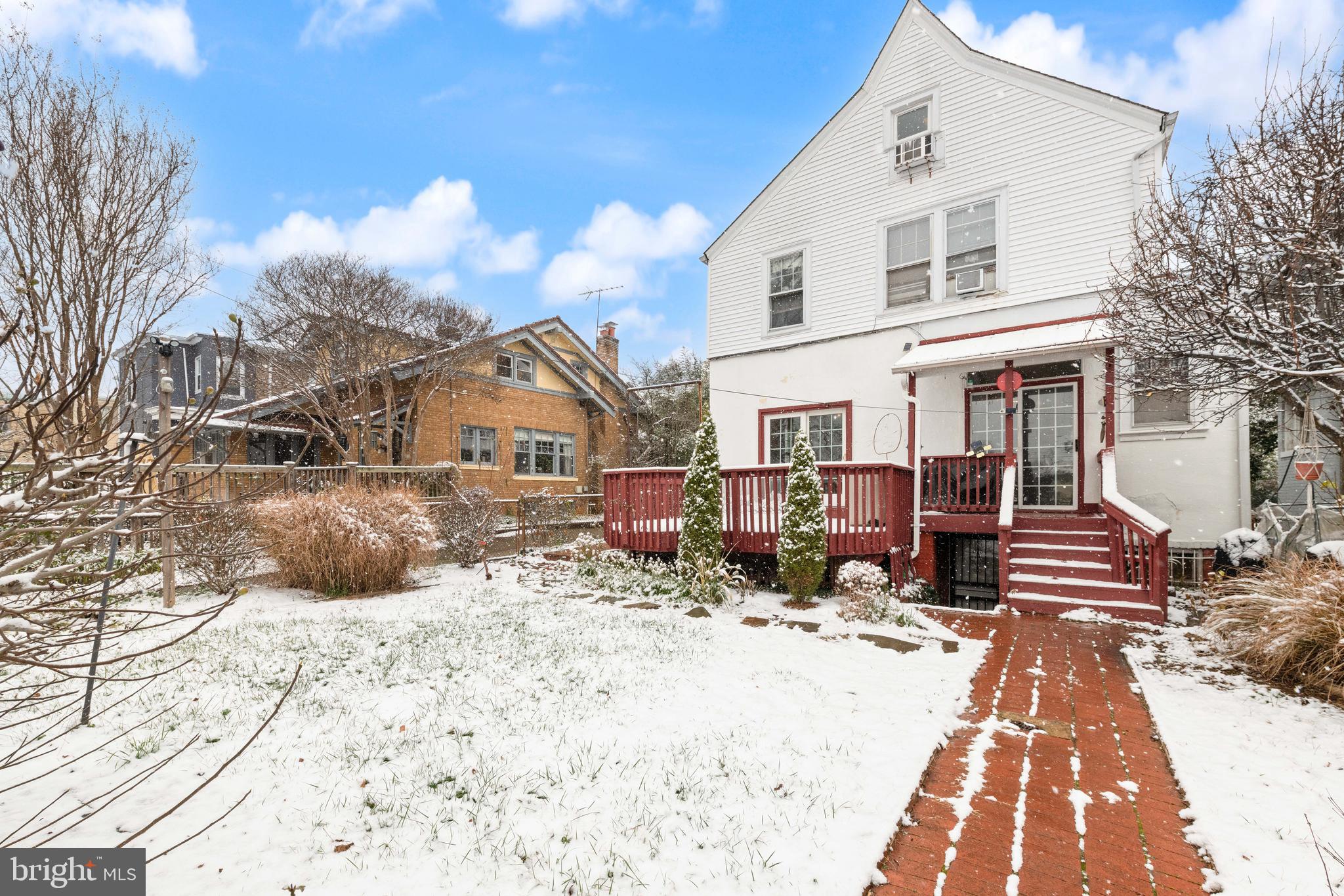 1702 Webster Street Northwest Washington, DC 20011 - Photo 36 of 42 a view of a house with snow on the road