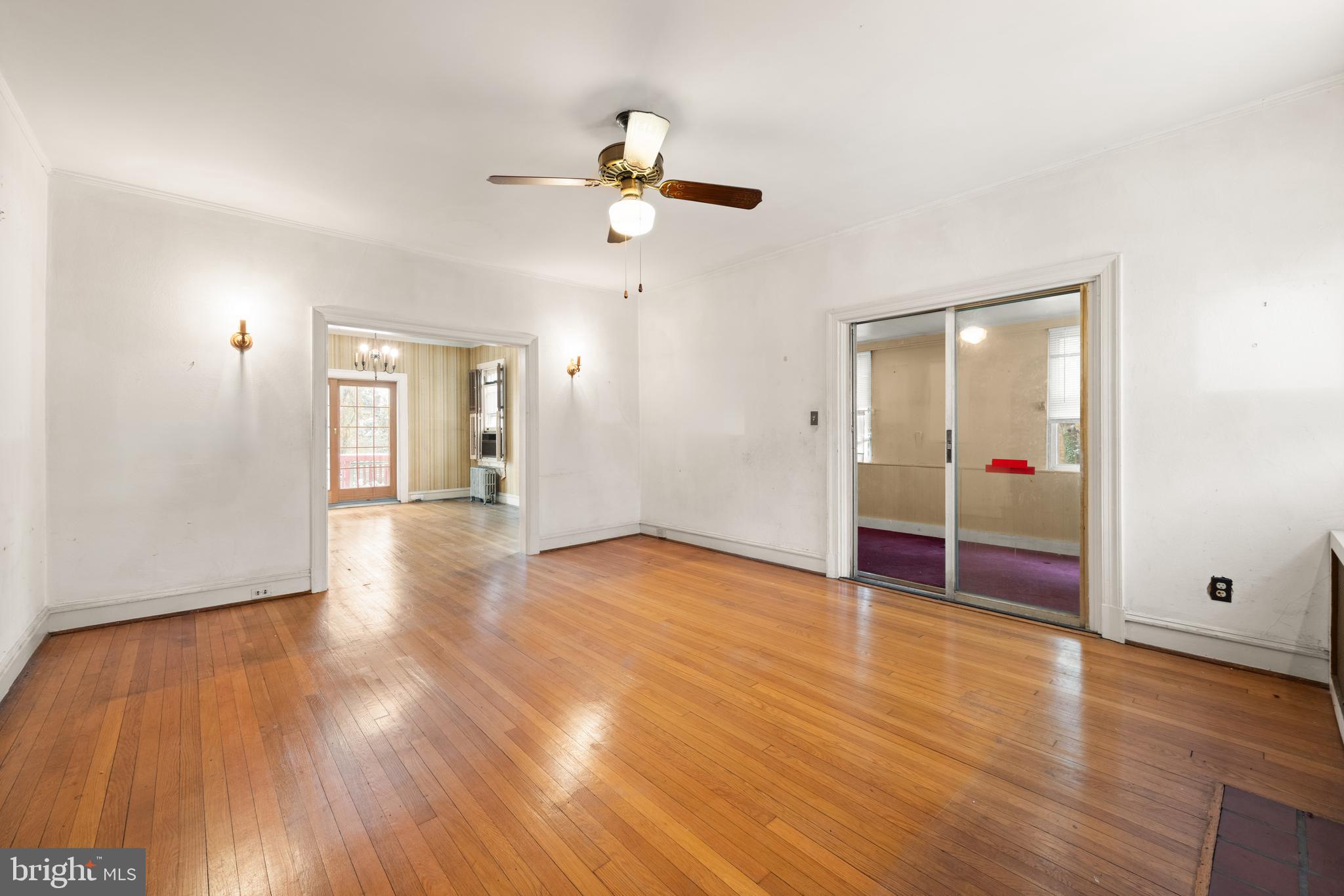 1702 Webster Street Northwest Washington, DC 20011 - Photo 6 of 42 wooden floor in an empty room with a window