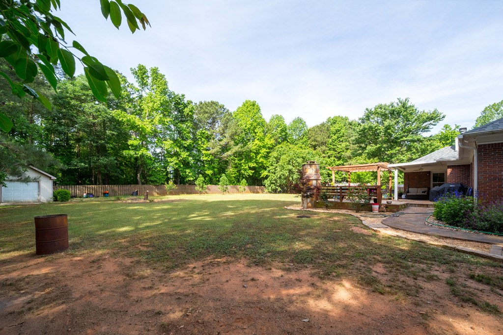 35 Bridle Court Ellerslie, GA 31807 - Photo 21 of 24 a view of a backyard with swimming pool