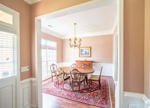 a view of a dining room with furniture and window