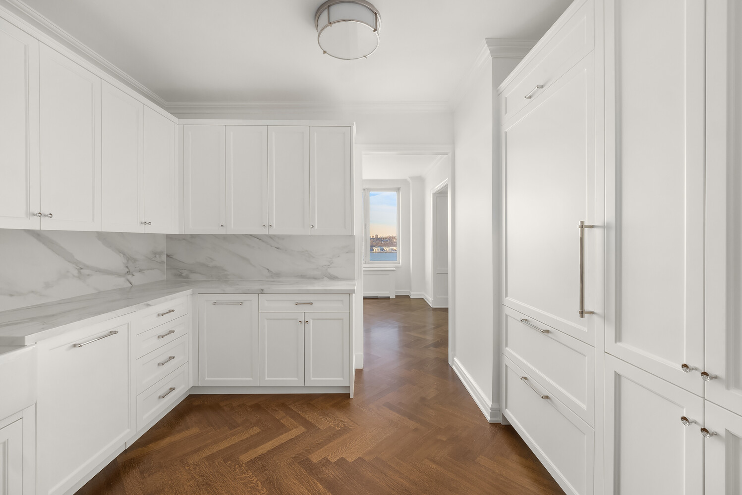 80 Riverside Boulevard, Unit 15B Manhattan, NY 10069 - Photo 10 of 26 a kitchen with white cabinets
