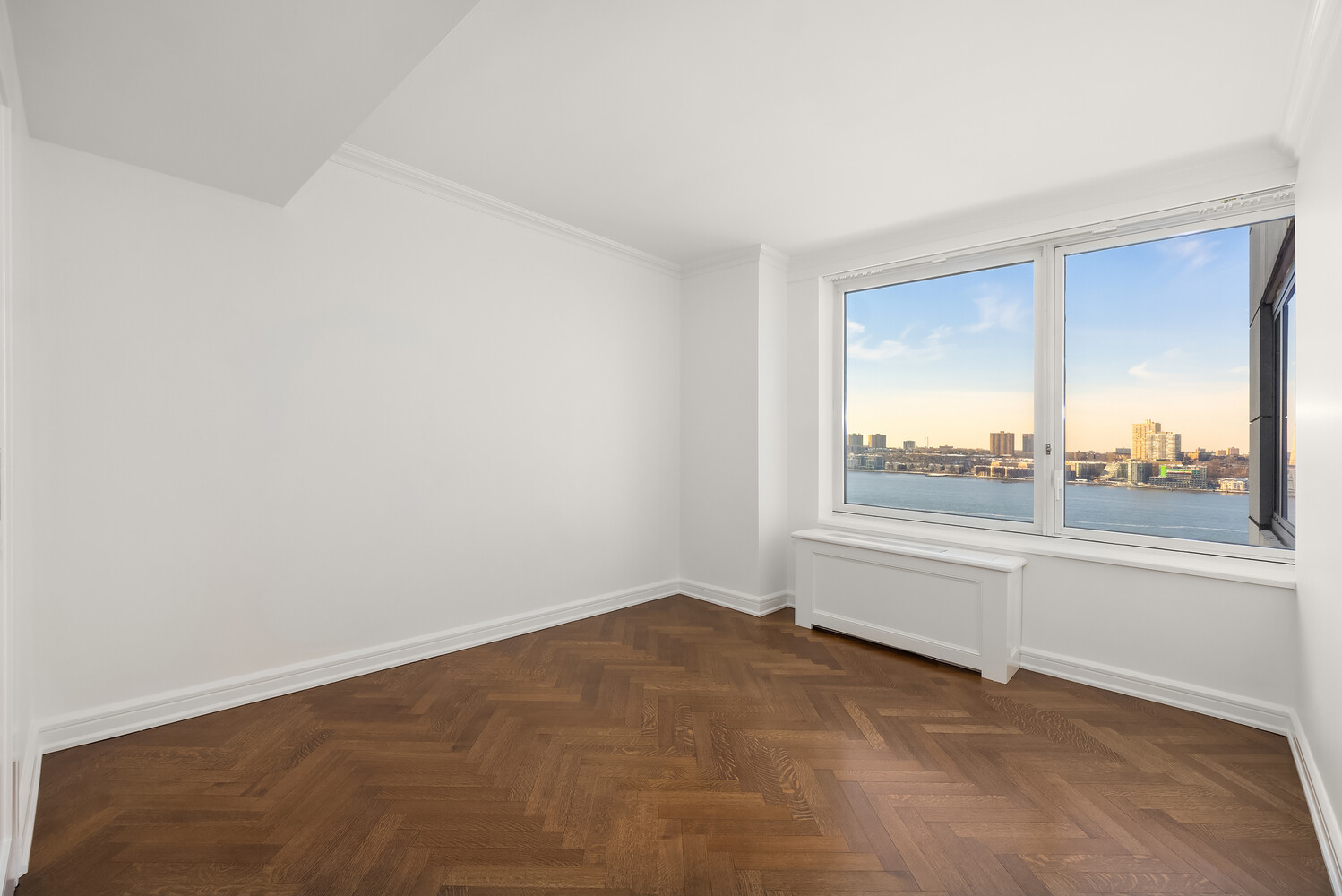 80 Riverside Boulevard, Unit 15B Manhattan, NY 10069 - Photo 15 of 26 an empty room with a large window