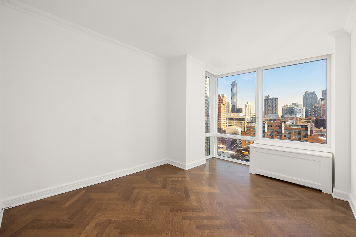 80 Riverside Boulevard, Unit 15B Manhattan, NY 10069 - Photo 18 of 26 a view of a living room hardwood and a kitchen