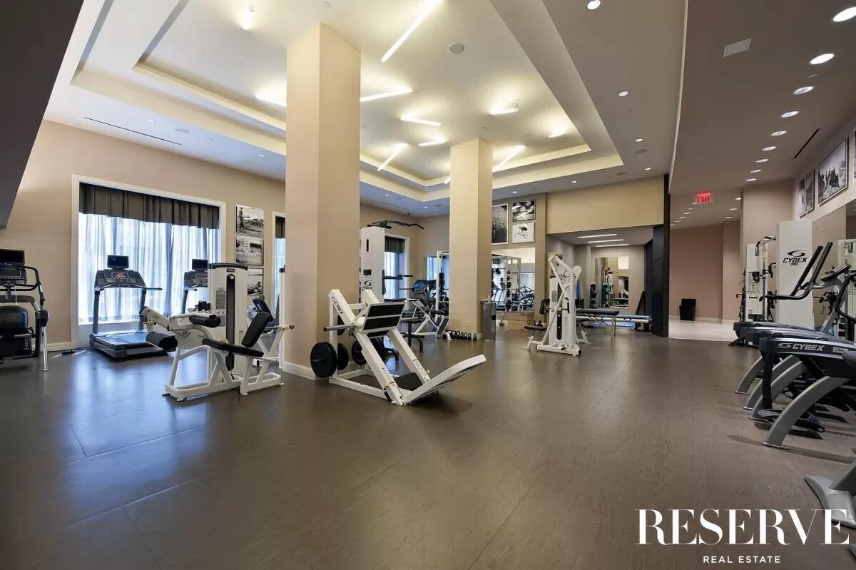 80 Riverside Boulevard, Unit 15B Manhattan, NY 10069 - Photo 22 of 26 a view of a room with gym equipment