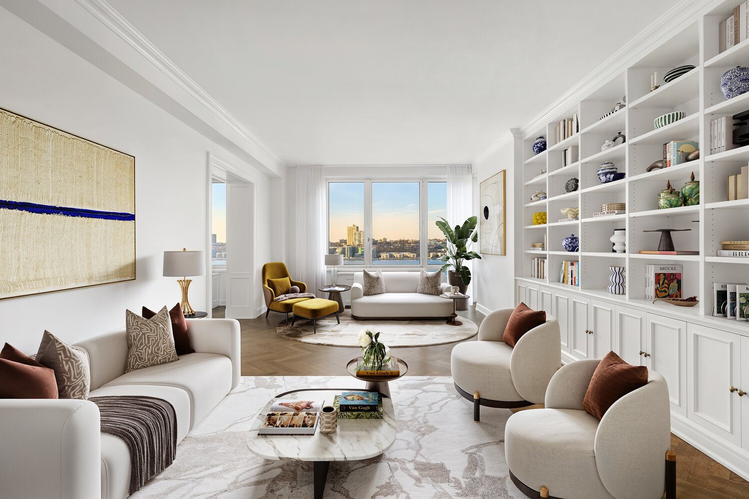 80 Riverside Boulevard, Unit 15B Manhattan, NY 10069 - Photo 3 of 26 a living room with furniture and a potted plant