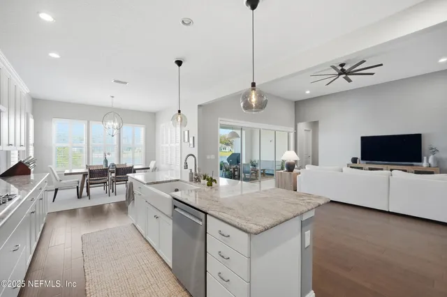 a reception area with glass top table and chairs