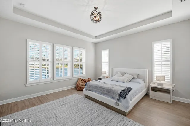 a bathroom with a granite countertop sink mirror and double