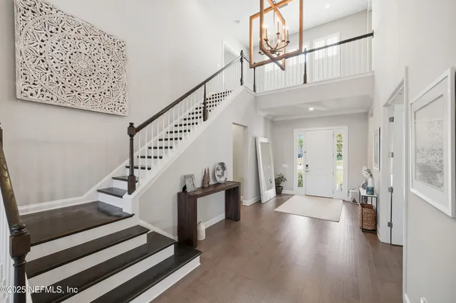 a very nice looking room with a large window and couch