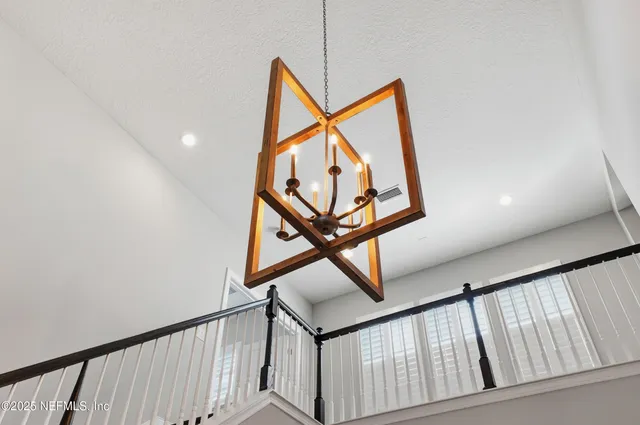 a living room with furniture a window and a flat screen tv