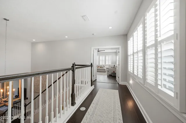 a spacious bedroom with two beds and a couch